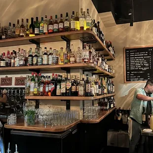 a man behind the bar at a bar