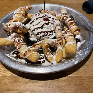 a banana split with ice cream and chocolate sauce