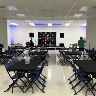a large room with tables and chairs