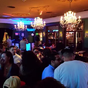 a group of people sitting at a bar