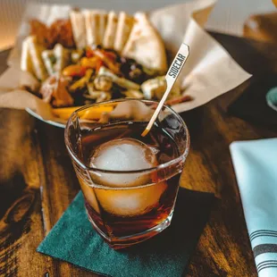  glass of beer and a plate of food