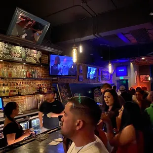 a large group of people at a bar