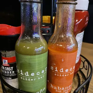 two bottles of hot sauce