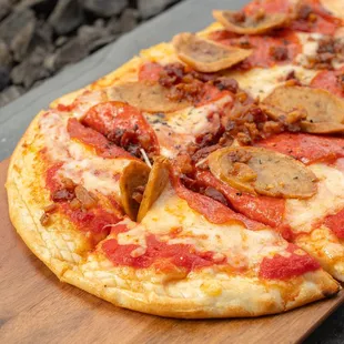 a pizza on a cutting board