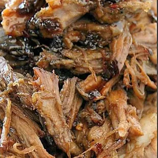 This is our juicy slow cooked Pulled Pork. Soooo yummy topped with our Spicy Bourbon sauce!