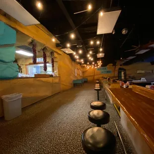 a restaurant with tables and chairs