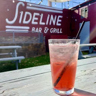 a drink on a picnic table