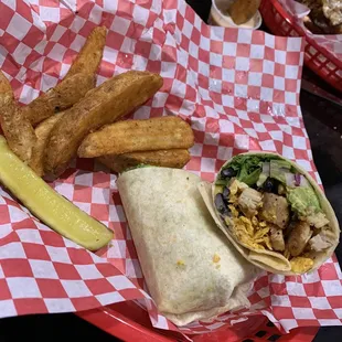 Grilled chicken wrap and potato wedges