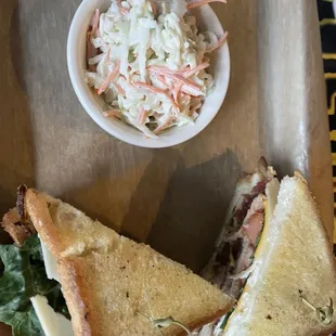 Turkey club and coleslaw.  Turkey is carved Turkey (not lunch meat).  Huge