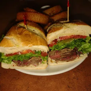 a steak sandwich and fries