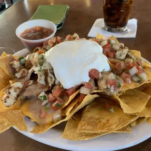 Half order of nachos (with chicken) was plenty for both of us!