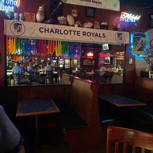 a bar with tables and booths