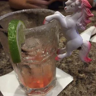 a unicorn drinking a drink