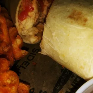 a burrito, fries, and ketchup