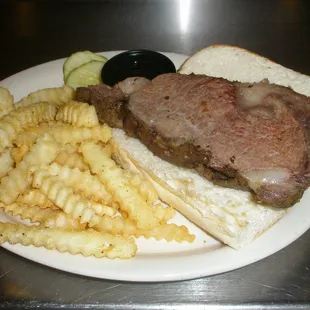a steak sandwich and french fries