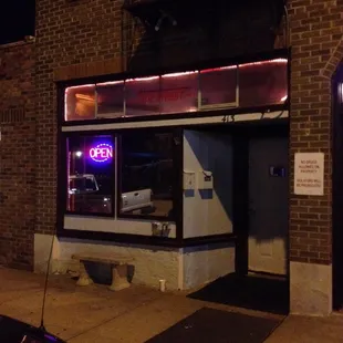 a neon sign in the window