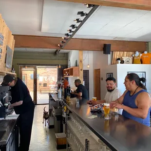 a group of people at a bar