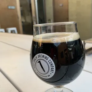 a glass of beer on a table