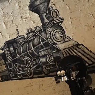 a train painted on a wall