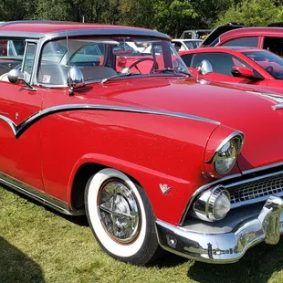 a row of classic cars at a car show