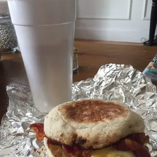 Bacon egg and Swiss cheese on an English muffin and a iced peanut butter cup coffee!