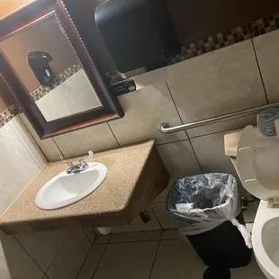 Clean men's bathroom. Single occupancy, lockable door.