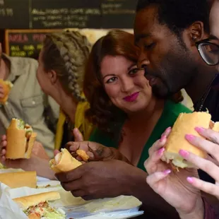 The crew enjoying an award-winning PoBoy from a local legendary establishment.