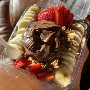a close up of a plastic container of fruit