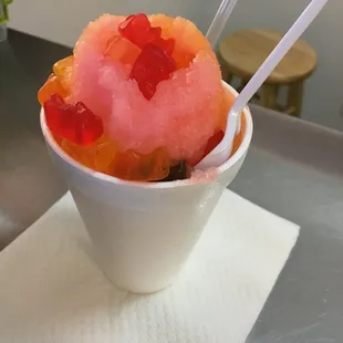 a bowl of ice cream with gummy bears