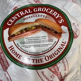 a sandwich wrapped in plastic