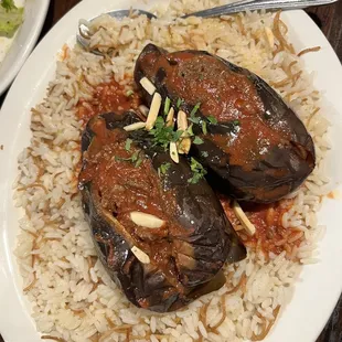 Eggplants stuffed with minced beef and pine nuts over Pilaf rice - house special