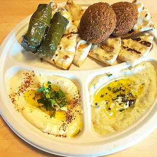 a plate of hummus and pita bread