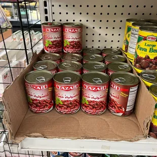 cans of canned food on a shelf