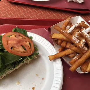 Sandwiches were huge (this is half), funnel cake fries were novel &amp; picked up a chocolate covered cheesecake slice for the road.