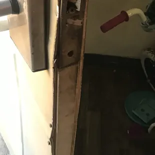 My door with nails sticking out of it and it looks like someone kicked it in