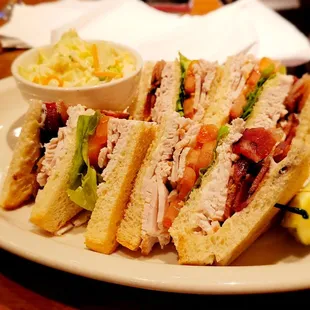 a plate of sandwiches with pickles