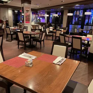 a restaurant with tables and chairs