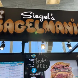 a sign for a bagel shop