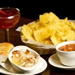 a bowl of chips and a bowl of salsa