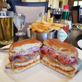 New chicken sandwich with blue cheese and buffalo sauce, tomato and onion.