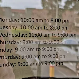 Business hours posted on the door