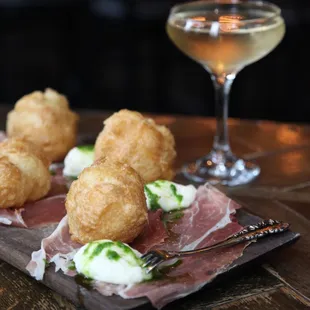 Coccoli: crispy dough, stracchino cheese, prosciutto di parma, truffle honey