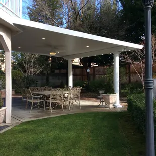 Recessed lighting, stylish paddle fan. Tuscan columns highlight patio.