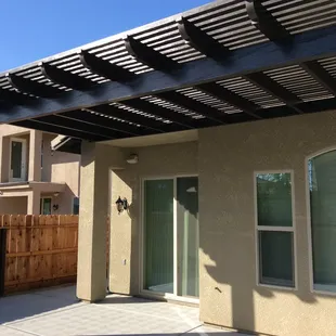 Attached brown cedar embossed latticed patio cover