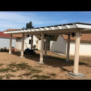 Freestanding solid roofed patio with Pv Array
