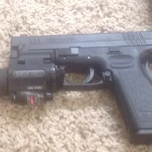 Springfield XD 45 cal with laser/light combo by surefire.