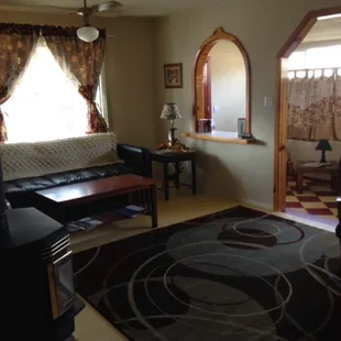 The Riverbend, a charming one bedroom, living area shown here