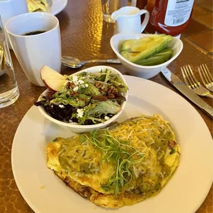 Southwest omelette w/ side salad and a side of avocado.