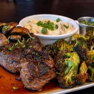 Wood fire grilled ribeye, smashed potatoes, roasted mushrooms and broccolini