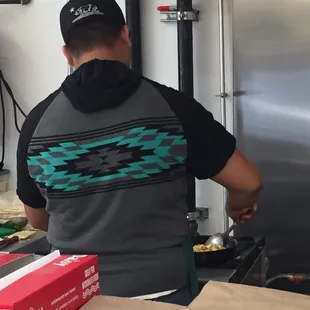 Guy making my Sierra breakfast burrito